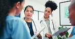 Tablet, planning and team with healthcare document, review records or case report evaluation. Women, doctor and nurses in collaboration with tech, medical discussion or paperwork feedback in hospital