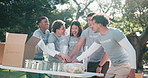 Volunteer, hands together and excited in park for food drive, charity collaboration and applause. People, happy and outdoor with teamwork for community service, synergy and motivation for outreach