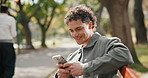 Phone, relax and man on park bench, typing text or thinking of funny response on vacation break. Mobile, smile and person in nature, message idea or online communication on social media with meme