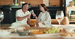 Love, cheers or couple in home with champagne, connection or bonding together on anniversary. Happy, wellness or mature people with drink, partner toast or romantic moment in healthy relationship.