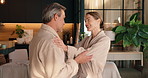 Happy, talking and mature couple at spa for bonding, connection and pamper for anniversary. Marriage, resort and man and woman in conversation, relationship and excited for treatment or salon service