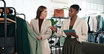 Fashion, client and women in clothing store with tablet, retail recommendation and sales discount. Tech, customer and happy person shopping in boutique at rack for style choice, help or merchandising