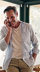 Digital, laugh and man in lounge with phone call, connection and happy moment in remote chat. Contact, talking and mature person in home with tech, discussion or joke reaction in online communication