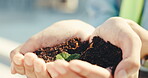 Engineer, closeup and hands with soil, outdoor and sustainable on construction site and restoration. Eco friendly, building and person with green development, civil engineering and plant growth