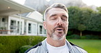 Breathing, fitness and thinking with man in neighborhood for commitment or dedication to training. Exercise, happy and inhale with mature runner outdoor in residential community for cardio workout
