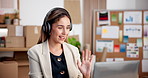 Consultant, wave and happy woman with headset in office for online video call or customer service. Female person, logistics or agent talking with computer for small business CRM or virtual assistance