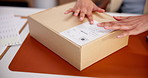 Person, hands or label with box for logistics, shipping instructions or delivery address in office. Supplier, employee or distributor packing parcel with sticker, package or cargo for courier service