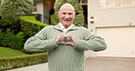 Home, face and old man in front yard with heart hands, property purchase and wellness for retirement. Happy, senior person outdoor and moving in new house with love emoji, good mood and real estate.