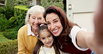 Selfie, grandmother and happy kid with mother outdoor by house for family memory, love or laughing. Face, generations and picture of girl with parent, smile and POV photo for social media status