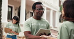 Volunteer, tablet and man with handshake for sign up outdoor, task delegation and happy. People, shaking hands and technology for community outreach, online checklist and charity or nonprofit team