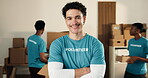 Man, volunteer and face in NGO with arms crossed, charity preparation and outreach program. Coordinator, confident and happy at centre for food drive, social responsibility or donations for project