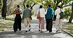 Students, walk and discussion at university with friends, community and support for higher education. Back, people and journey outdoor at college with scholarship, conversation or hangout after class