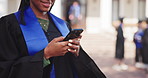 Graduation, typing and woman with phone at college for news, social media and update for success. University, happy and graduate on cellphone for message for education, learning and study achievement