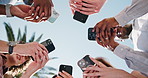 University, hands and below of students with phone for social media, connection and networking. Education, circle and friends on cellphone outdoor for internet, college website and exam results