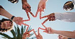 People, unity or hands together with star sign for social cohesion, inclusion or solidarity in park. Low angle, group or community with gesture or shape for outdoor synergy, collaboration or teamwork