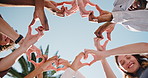 People, unity or friends with heart hands in park for love, social cohesion or solidarity. Low angle, group or community with romantic gesture, shape or emoji for outdoor passion, charity or donation