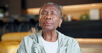 Zen, old woman and meditation in home, mindfulness and stress relief on break or spiritual awareness. Calm, retirement and senior person with inner peace on weekend, breathing and wellness in lounge