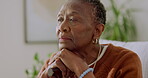 Senior, woman and thinking in home for retirement, nostalgia or mindfulness with reflection in lounge. African person, memory and serious calm with history, past and remember with pension mindset