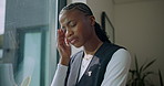 Black woman, nurse and headache with grief in nursing home, stress or wellbeing by window. Caregiver, upset or migraine with loss of patient, massage temple or mental health crisis at facility