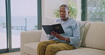 Senior, woman and Bible in living room reading scripture, Christianity or faith with gospel. Old person on sofa, holy literature for worship or religious education with spiritual wellness in home