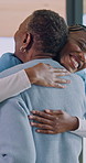 Caregiver, dancing and old woman in nursing home with hug, wellness and celebration for good health. Happy, black people and nurse with embrace for senior patient, support or movement with positivity