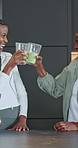 Smile, black family and cheers in kitchen with smoothie, healthy drink and morning for nutrition. Old woman, adult daughter and toast at house with beverage, protein shake and celebrate for digestion