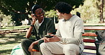 Happy, nurse and students at park with phone, research and streaming podcast for medical education. Smile, people or friends in nature with headphones, interaction and listening to music for learning