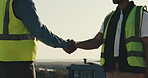 Team, people and shaking hands on rooftop for construction, trade handoff or building approval. Engineer, project manager or handshake outdoor for phase completion, site inspection or code compliance