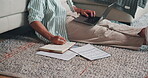 Hands, writing and financial planning with laptop in lounge, online and checking investment on web. Asset management, notes and person with documents, research and budget review with tech in house