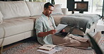 Financial planning, research and man with laptop in lounge, paperwork or checking investment on web. Asset management, online and person with documents, taxes and budget review with tech in house