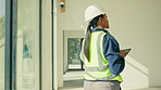 Construction, woman and tablet for property inspection, safety or reporting for project closeout. Tech, QA inspector and building walk through for quality standards, log punch list and mep finishing