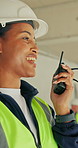Engineering, woman and speaking at construction site with radio, coordination and supervisor advice. Engineer, person and talk in building with tech, instructions and guidance for project management.