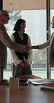 Office, meeting and business people with handshake for real estate, property investor or evaluation. Boardroom, team and man shaking hands with consultant for welcome, negotiation and commercial deal