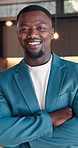 Real estate, face or black man in house with arms crossed, leasing agent or pride in housing market. Happy, portrait and realtor with confidence, property seller and about us in commercial industry.