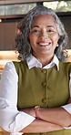 Real estate, face or woman in house with arms crossed, leasing agent or pride in housing market. Happy, portrait and mature realtor with confidence, property seller or about us in commercial industry
