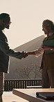 Realtor, people or handshake with investor on balcony for building ownership or property investment. Businessman, real estate agent and shaking hands with client for open house agreement or deal