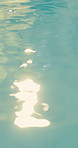 Water, pool and sunshine with ripple for peace, hotel resort or empty location for calm environment. Holiday, tranquil and travel destination with liquid or aqua motion for relax or vacation on space