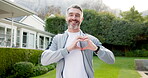 Face, fitness and heart hands of man in neighborhood for commitment or dedication to cardio training. Exercise, proud and smile with mature runner outdoor in residential community for health workout