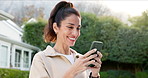Woman, smile and typing in backyard with phone, check social media app and text message notification. Happy, mature person and outdoor by home with tech, internet and connectivity for online chat.