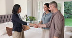 Couple, talk and handshake in home with realtor, deal negotiation or success for property investment. Happy, married people and shaking hands in house with real estate agent, tablet or buy residence.