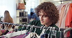 Shopping, rack and customer in store with clothes, outfit search or decision with trendy style. Retail, check or man in boutique with apparel collection, garment choice or option for fashion purchase