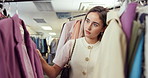 Shopping, selection and customer in store with clothes, outfit search and decision with trendy style. Retail, check and woman in boutique with apparel, garment choice and option for fashion purchase.