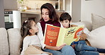 Love, mother or children on couch with book, parent storytelling or bonding with reading hobby. Childcare, mom or kids in house with story, quality time or family connection with literature activity.