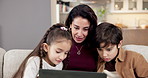 Ebook, laptop and mother reading to children on sofa in living room together for bonding or break. Computer, storytelling and woman with sibling kids in family home for development or learning