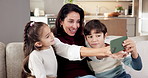 Mom, children and selfie on sofa in home for holiday, weekend break or mothers day together. Parent, smile and kids with sibling or photography on couch for capture moment, memory or picture in house