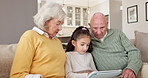 Grandparents, learn and child with tablet in lounge, talk and senior people with skill development. Digital literacy, knowledge and family with technology, discussion and bonding with girl in house