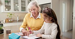 Writing, grandma and child with homework for help, assessment and learning for development. Family, home and girl with grandmother, answer sheet and support for education, knowledge and growth