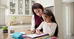 Writing, mom and child with homework for help, assessment and learning for education development. Family, home and girl with mother, answer sheet and support for knowledge, guidance and parenting