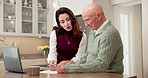 Document, discussion and old man with adult daughter for retirement home application, laptop or help. Elderly dad, woman and conversation in house with paperwork, insurance policy form or assistance.