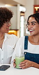 Couple, laugh and talk in cafe with matcha, funny story and bonding together for wellness on weekend. Happy, people and date in coffee shop with drinks, romantic partner and humor for relationship.